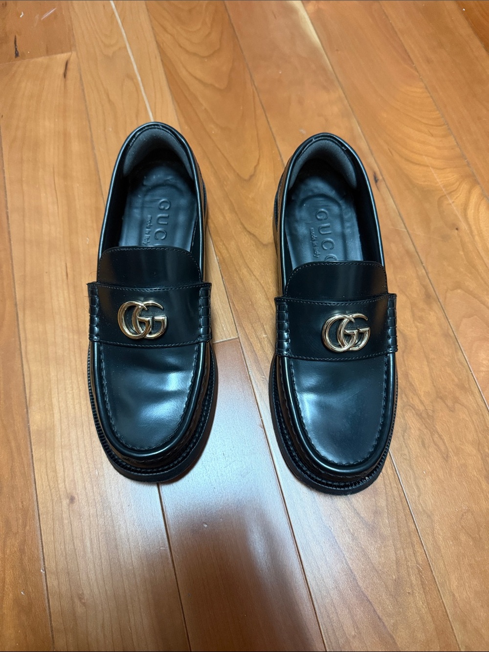 Gucci women’s Black Leather GG Logo Loafers